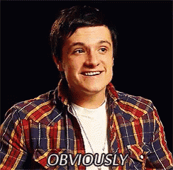 a man wearing a plaid shirt is smiling and says obviously