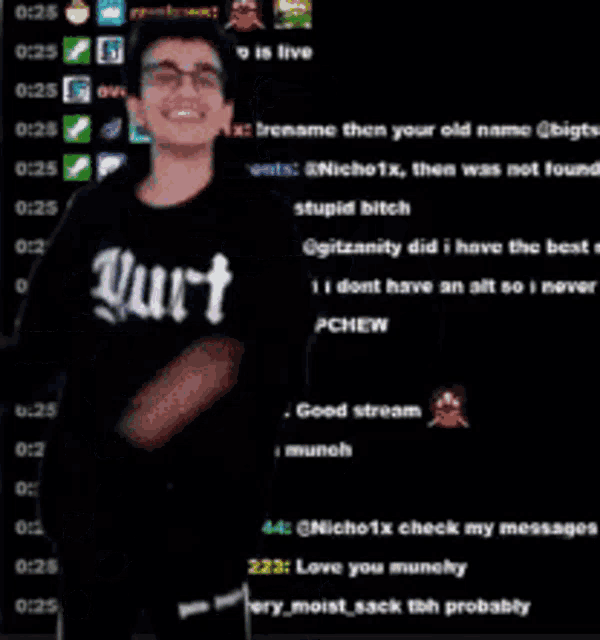 a man with glasses is standing in front of a screen that says ' twitch ' on it