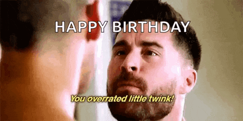a man with a beard is looking at himself in the mirror and says `` happy birthday you overrated little twink ! ''