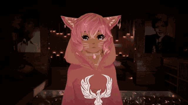 a girl with pink hair and cat ears wears a pink hoodie with a white phoenix on it