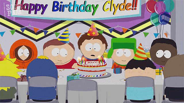 a group of south park characters sitting around a table with a birthday cake