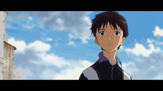 a boy with a blue sky in the background