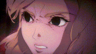 a close up of a woman 's face with a very angry look on her face .