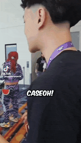 a man and a woman are standing next to each other and the man says caseoh