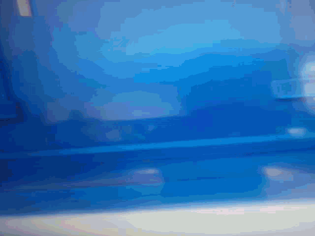 a blurred image of a blue background with a white border