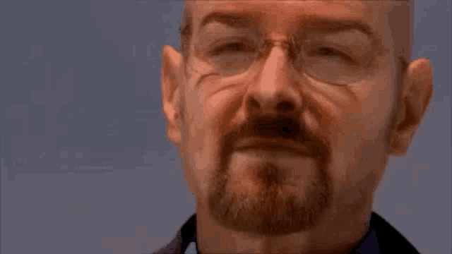 a man with glasses and a beard is making a funny face and says `` you 're goddamn right '' .