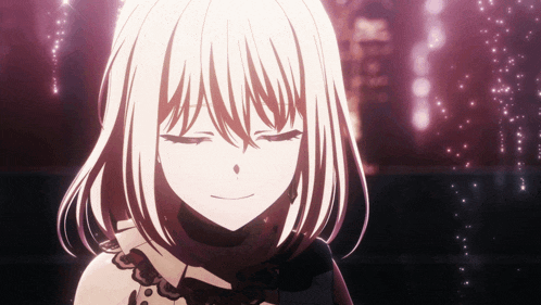 a girl with white hair is smiling with her eyes closed in a dark room