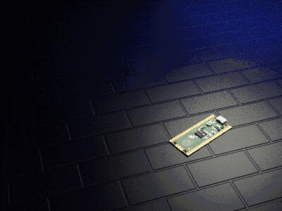a small electronic device is laying on a black tile floor