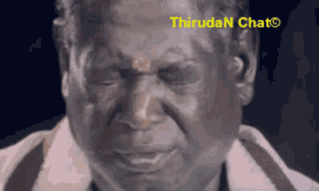 a close up of a man 's face with the words thiruda n chat visible