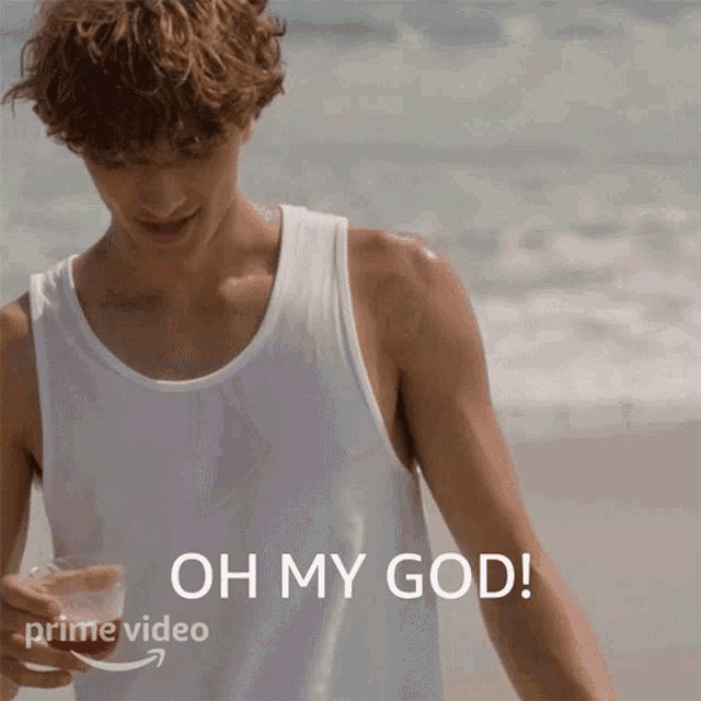 a man in a white tank top is holding a glass of water with the words oh my god written below him
