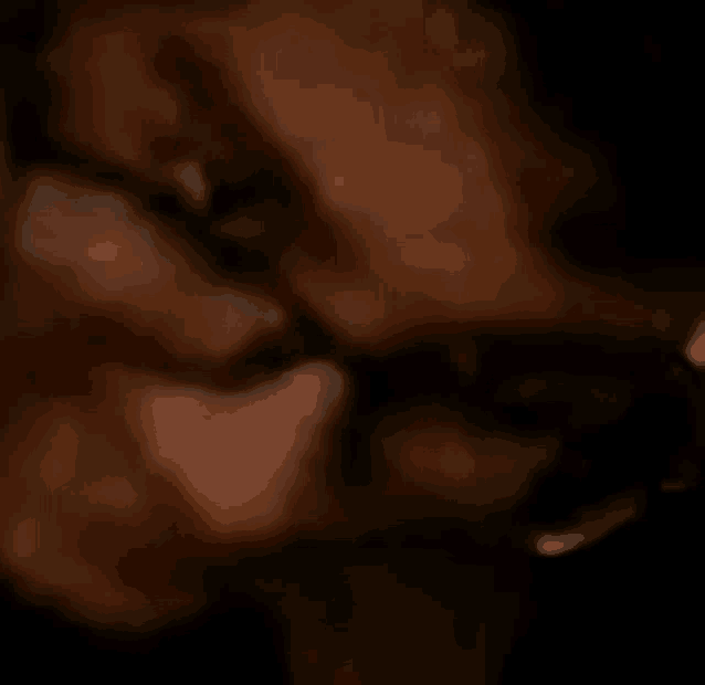 a close up of a person 's face with glasses and a gun .