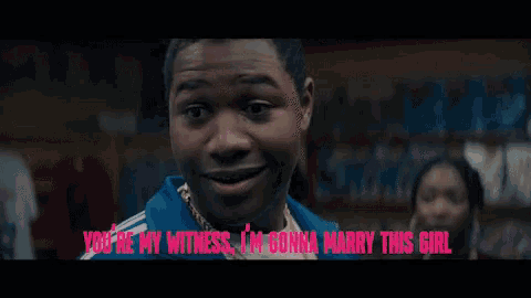a man says " you 're my witness i 'm gonna marry this girl " in pink letters