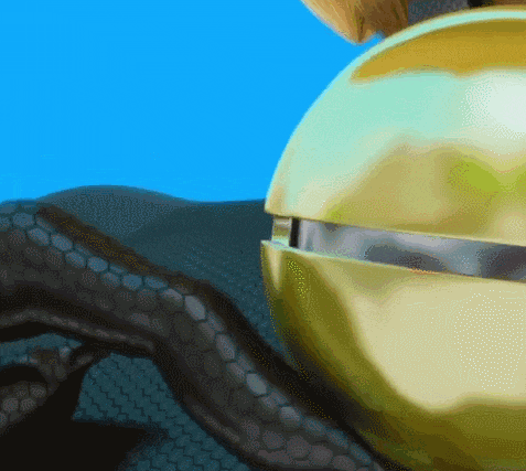 a close up of a gold object with a blue sky behind it
