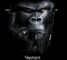 a gorilla is wearing headphones and holding a microphone .