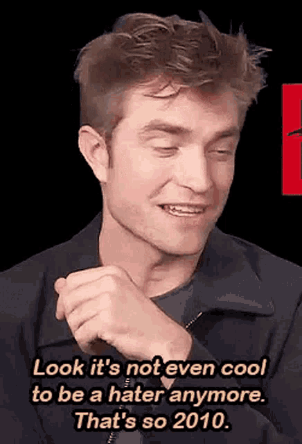 a man is making a funny face and saying `` look it 's not even cool to be a hater anymore .