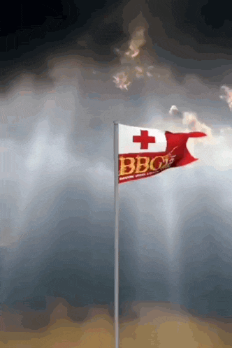 a flag with the word bbc on it is flying in the wind