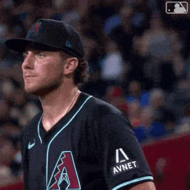 a baseball player wearing a black hat with the letter a on the front