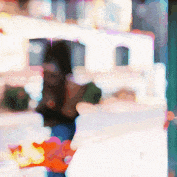 a blurry picture of a person standing in front of a display