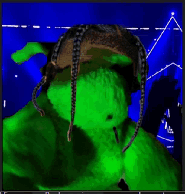 a green stuffed animal wearing a brown hat