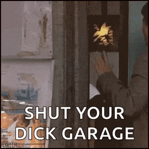 a man is standing in front of a refrigerator with the words `` shut your dick garage '' on it .