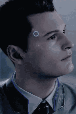 a close up of a man 's face with a circle on his forehead