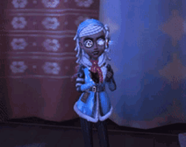 a doll in a blue dress is standing in front of a curtain