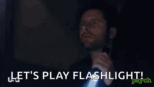 a man is holding a flashlight with the words let 's play flashlight behind him