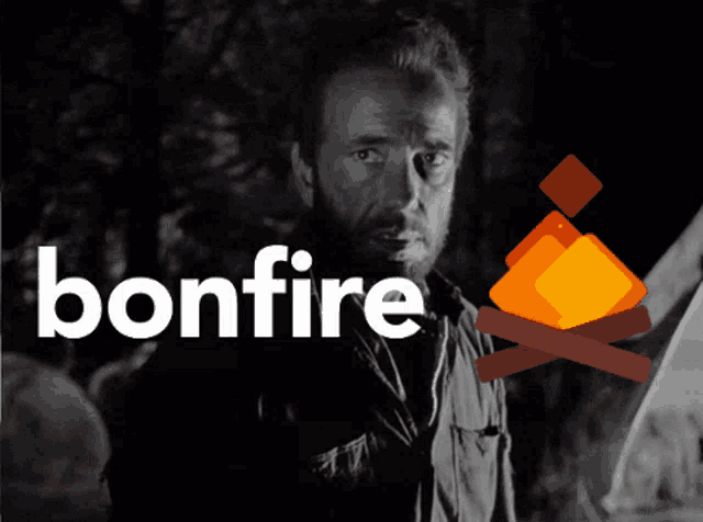 a man with a beard stands in front of a bonfire sign