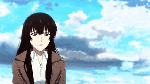 a woman with long black hair stands in front of a blue sky with clouds