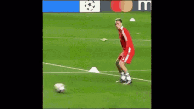 two soccer players are playing a game of soccer on a field . one of the players has the number 39 on his jersey .