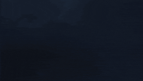 a blue lightning bolt strikes a white circle in the dark