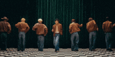 a group of people are dancing in front of a sign that says psychic juice