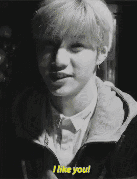 a young man says i like you in a black and white image