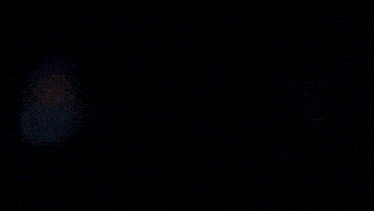 a pixelated image of a person looking out a window at the ocean