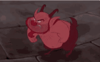 a cartoon devil is standing on a tiled floor .