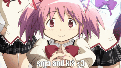 a girl with pink hair has sora and kia < 3 written on her sleeve