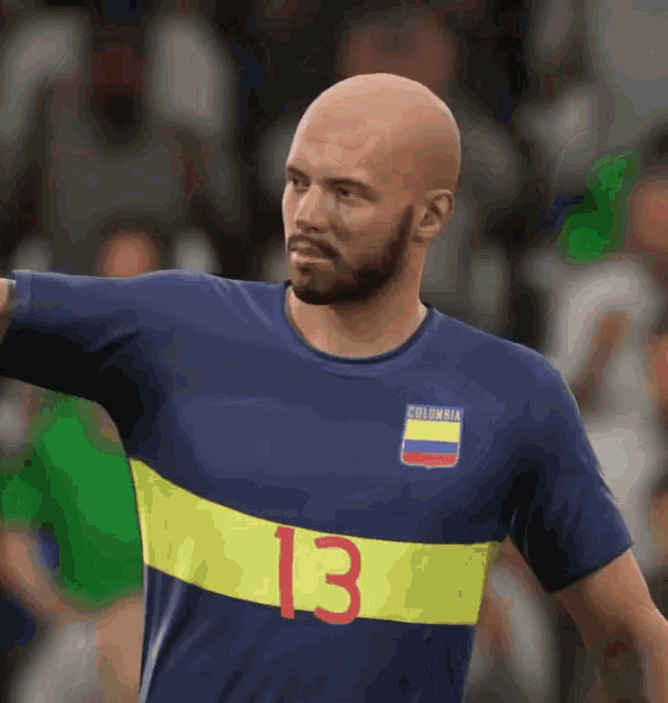 a bald man with a beard is wearing a colombia jersey with the number 13