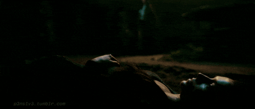 a woman is laying on the ground in a dark room and the website p3nstv3.tumblr.com is visible in the corner