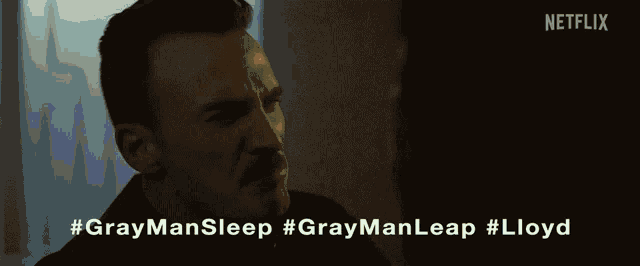 a netflix advertisement for gray man sleep shows a man screaming