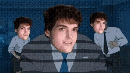 a man in a suit and tie is surrounded by two other men .