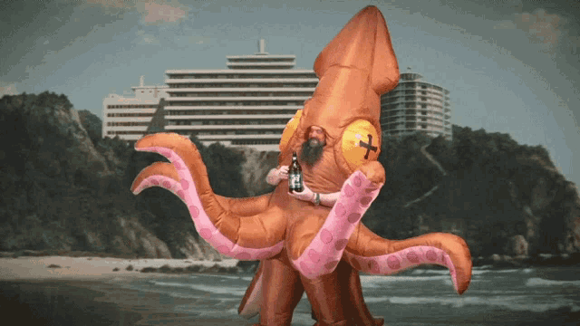 a man in a squid costume is holding a bottle of beer