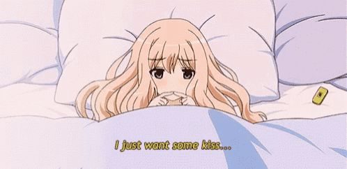 a girl laying in bed with the words " i just want some kiss " on the bottom