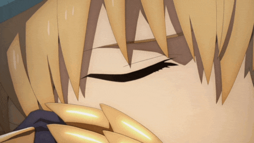 a close up of a person 's eye with a gold armor