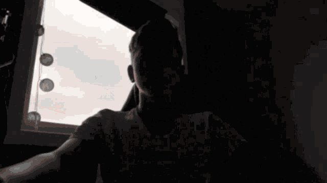a blurred image of a person wearing a white shirt that says nike on the front