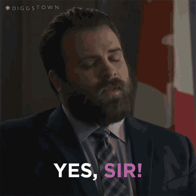 a man in a suit and tie says " yes sir "