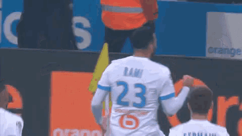 a soccer player wearing the number 23 jersey