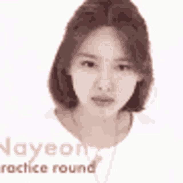 a close up of a woman 's face with short hair and a white shirt on a white background .