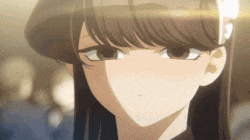 a close up of a girl 's face with the sun shining on it