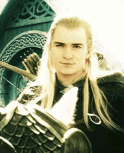 a man with long blonde hair is holding a sword and bow