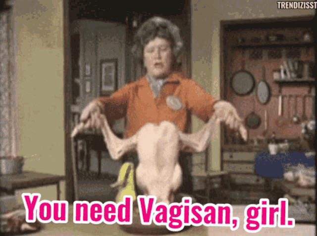 a woman is holding a dead chicken with the words you need vaginan girl below her
